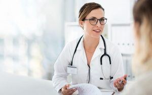 female-doctor-talking-to-a-patient-in-bright-office-setting