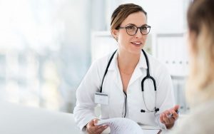 female-doctor-talking-to-a-patient-in-bright-office-setting